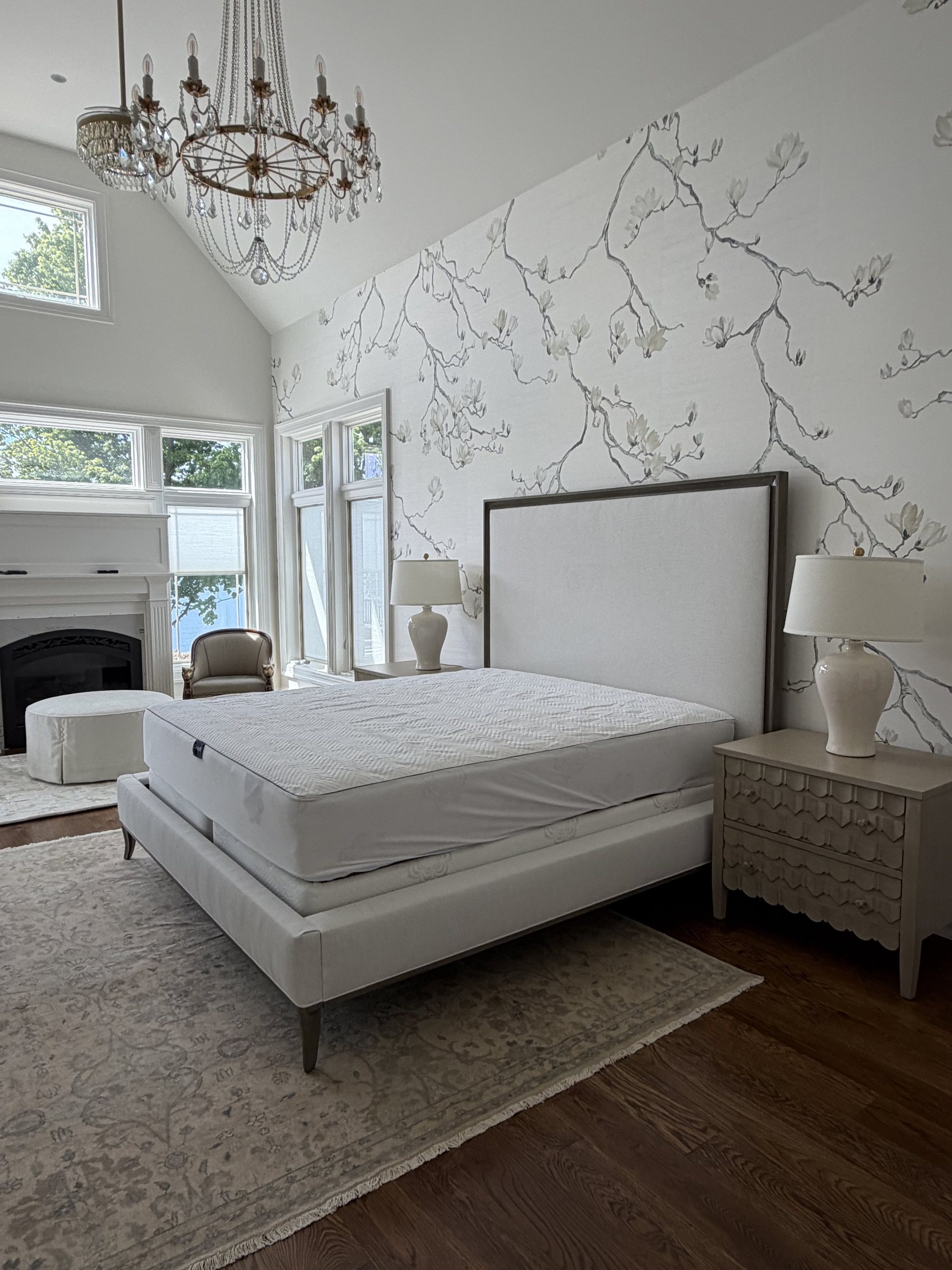 Photo of the built primary bedroom with the same wallpaper