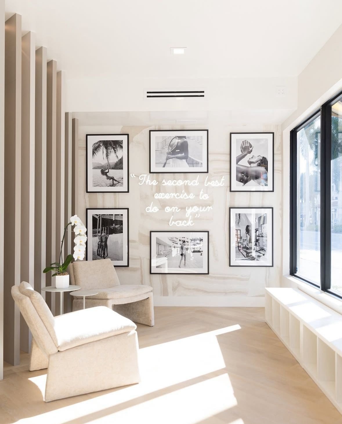 Lounge corner with framed photos and lounge chairs